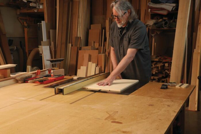 The author feed the piece over the table saw