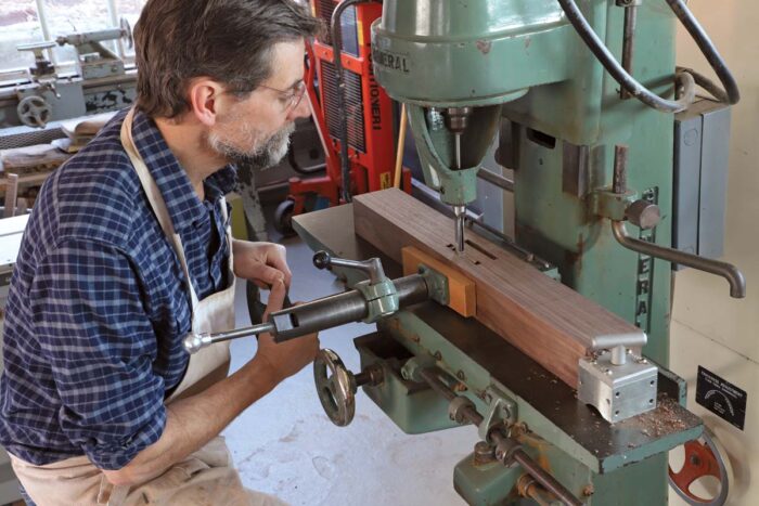 Tom makes two mortises with a hollow chisel mortiser.