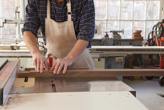 Tom uses a dado stack and miter guage to cut the shoulders of a tenon on a long stretcher.