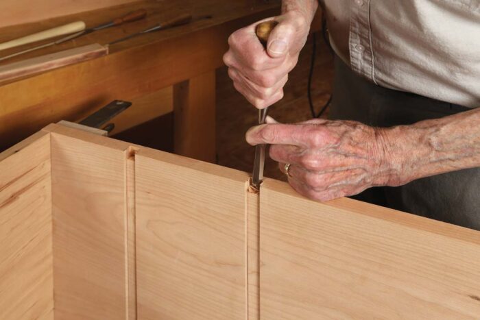 Chris Chisels a dovetail shaped mortise in the sides of the shaker inspired side chest.