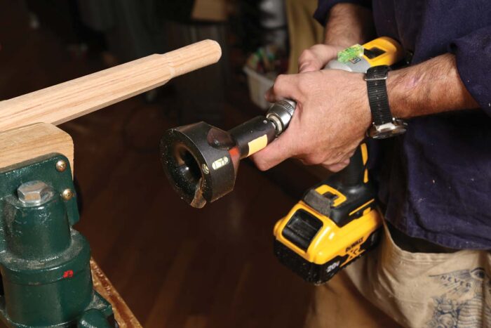 A tenon cutter is mounted in a drill. It's huge and the whole thing looks like a blaster out of Star Wars. 